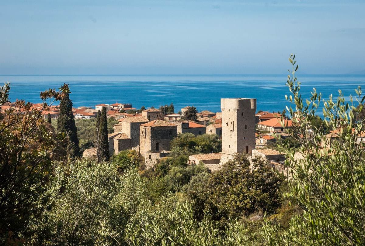 Iconic stone tower houses in Mani, Greece, a central feature of our regional tours and outdoor activities.