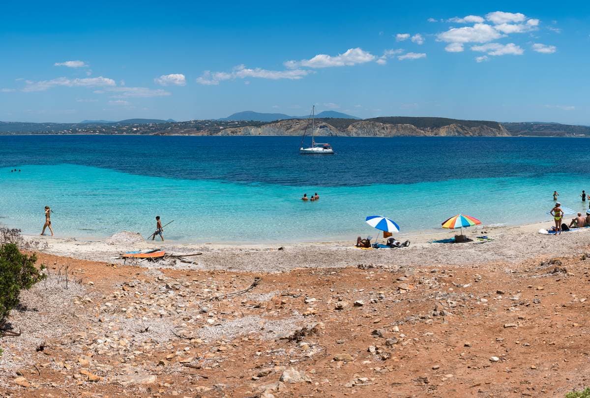 Panoramic view of the white sandy beach and crystal clear water at Sapienza