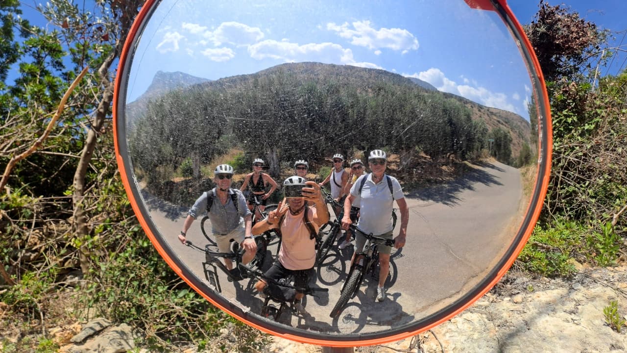group mirror selfie on winding coastal road