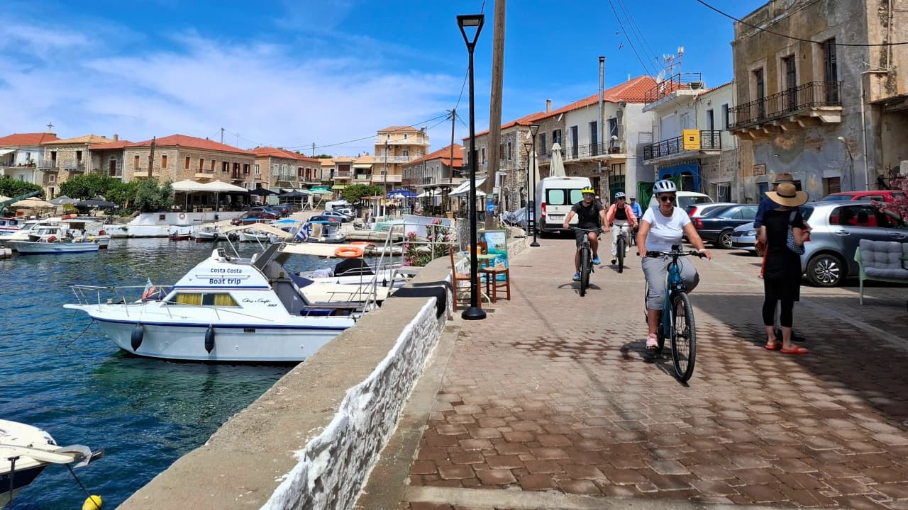 riding through stone lined waterfront traditional village