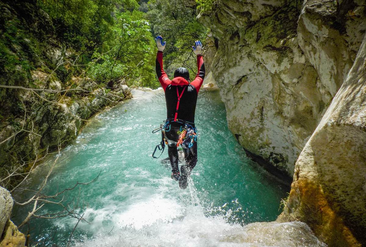 Canyoning-in-Greece-Neda-Waterfall-Jump Canyoning in Greece with a guide jumping into the turquoise waterfalls of the Neda river.
