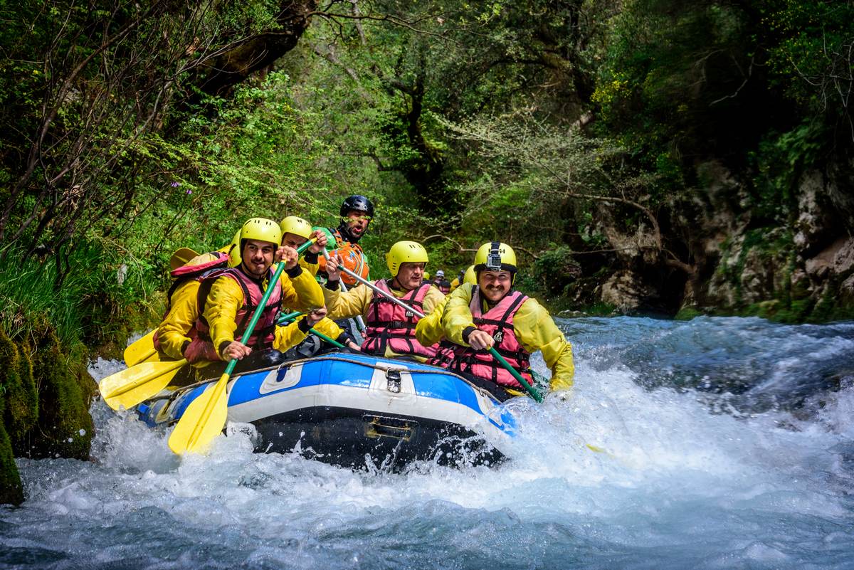 Whitewater Rafting Adventure in Lousios River – Explore Messinia Guided rafting group navigating the whitewater rapids of the Lousios River in Arcadia, Peloponnese