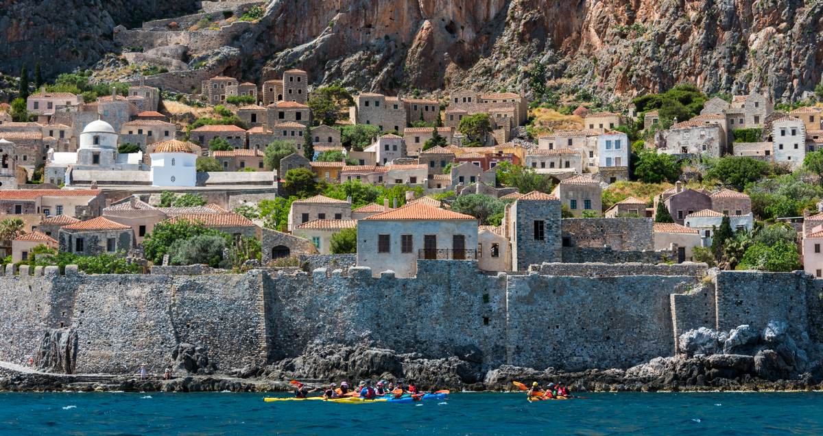 Paddlers exploring the south side of the fortress walls by Sea Kayaking Monemvasia