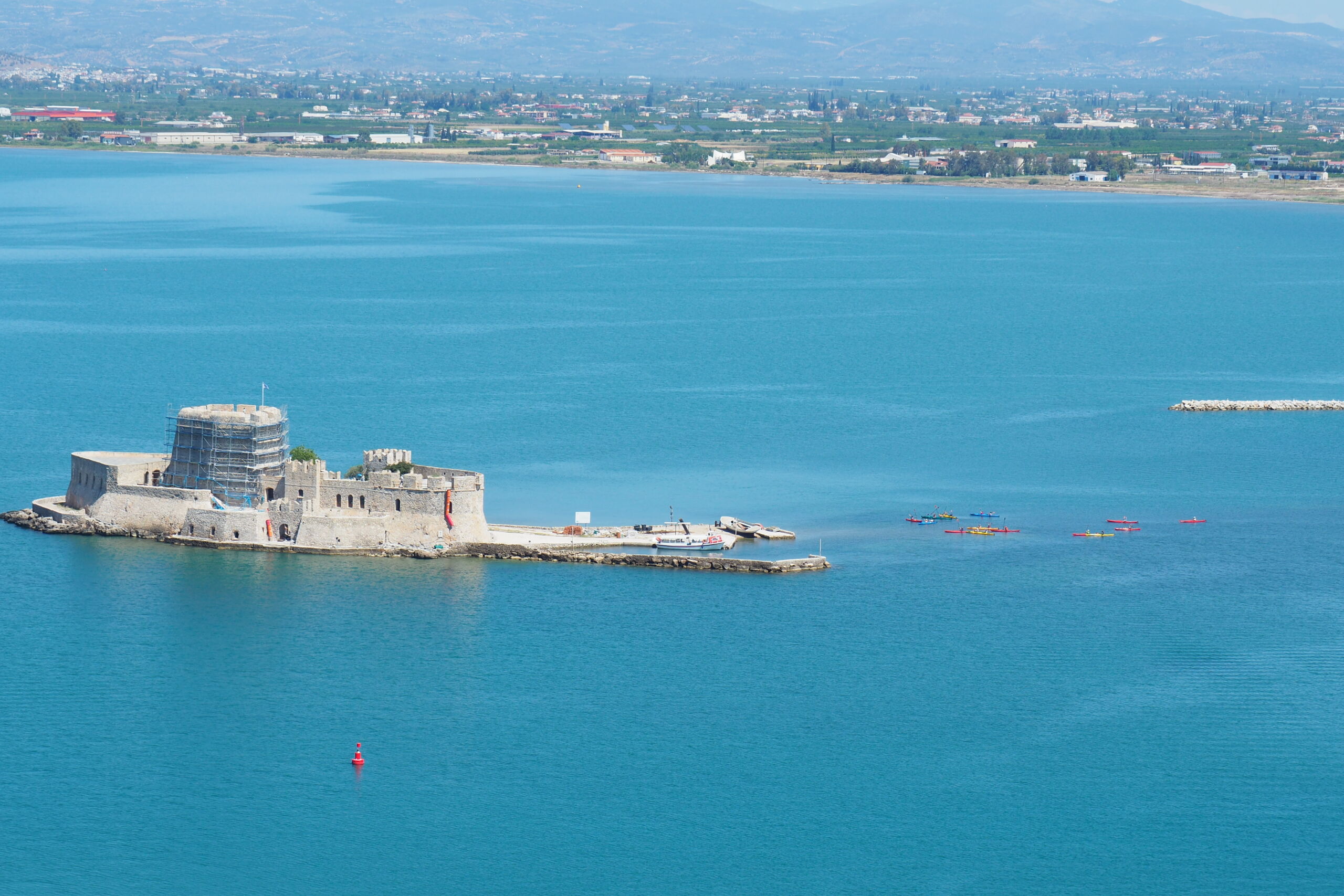 Aerial view of the Bourtzi islet and kayakers during a guided Sea Kayaking Nafplio adventure