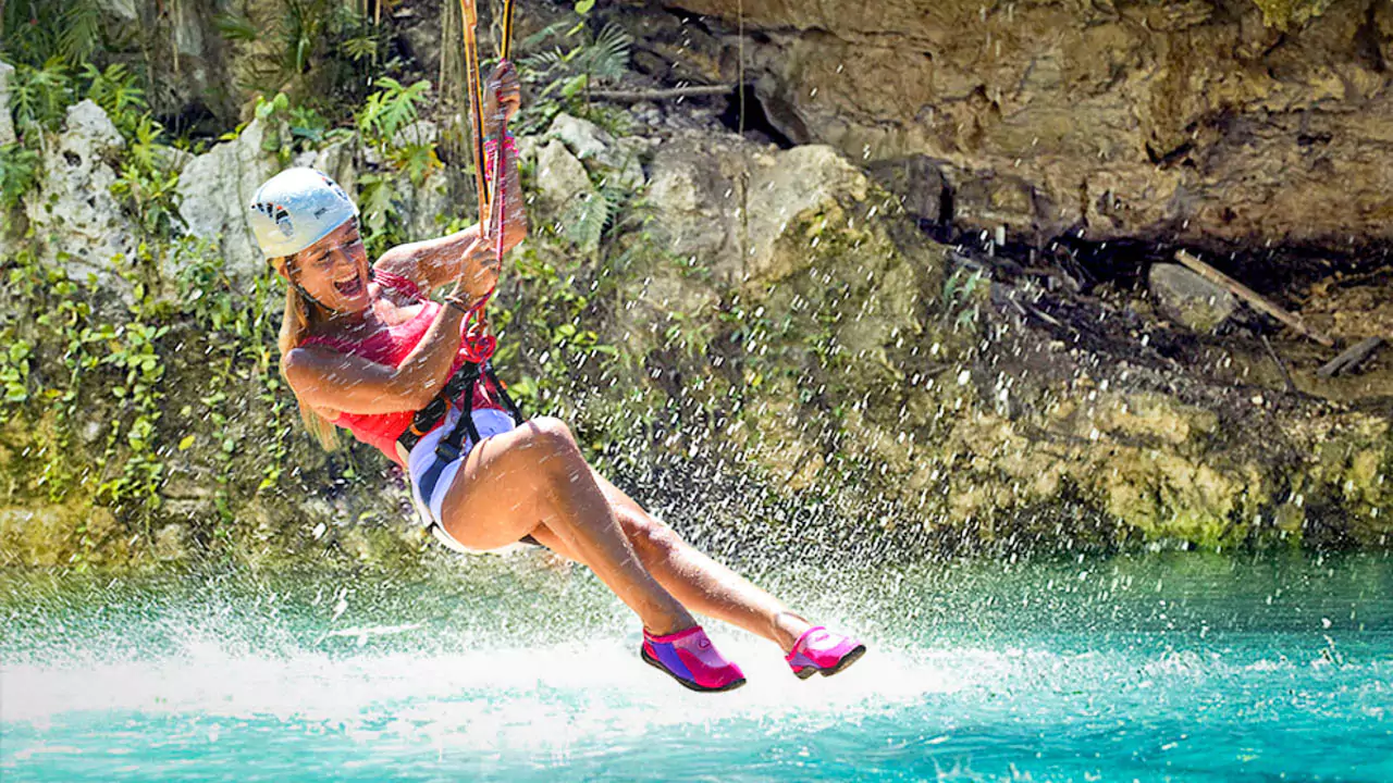 Explore Messinia-a girl having great fun on a zipline at Polylimnio