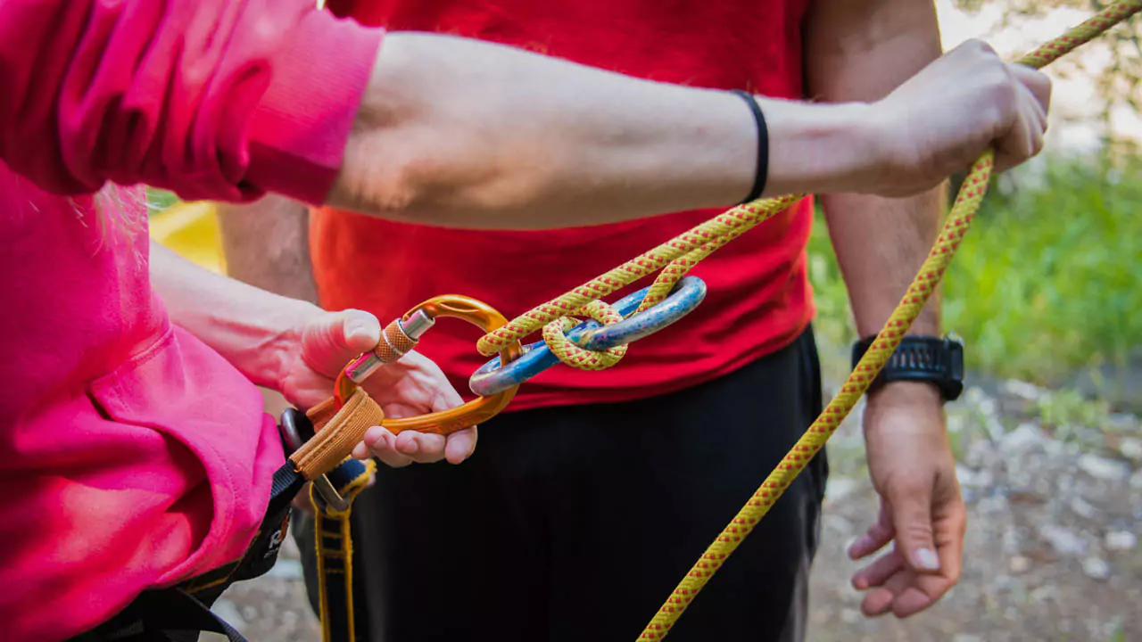 Explore Messinia- Equipping a group with harnesses at the starting point. Explore Messinia guides equipping a smiling group with helmets and harnesses at the starting point of Polylimnio canyoning adventure, emphasizing safety and professionalism in thrilling outdoor activities in Greece.