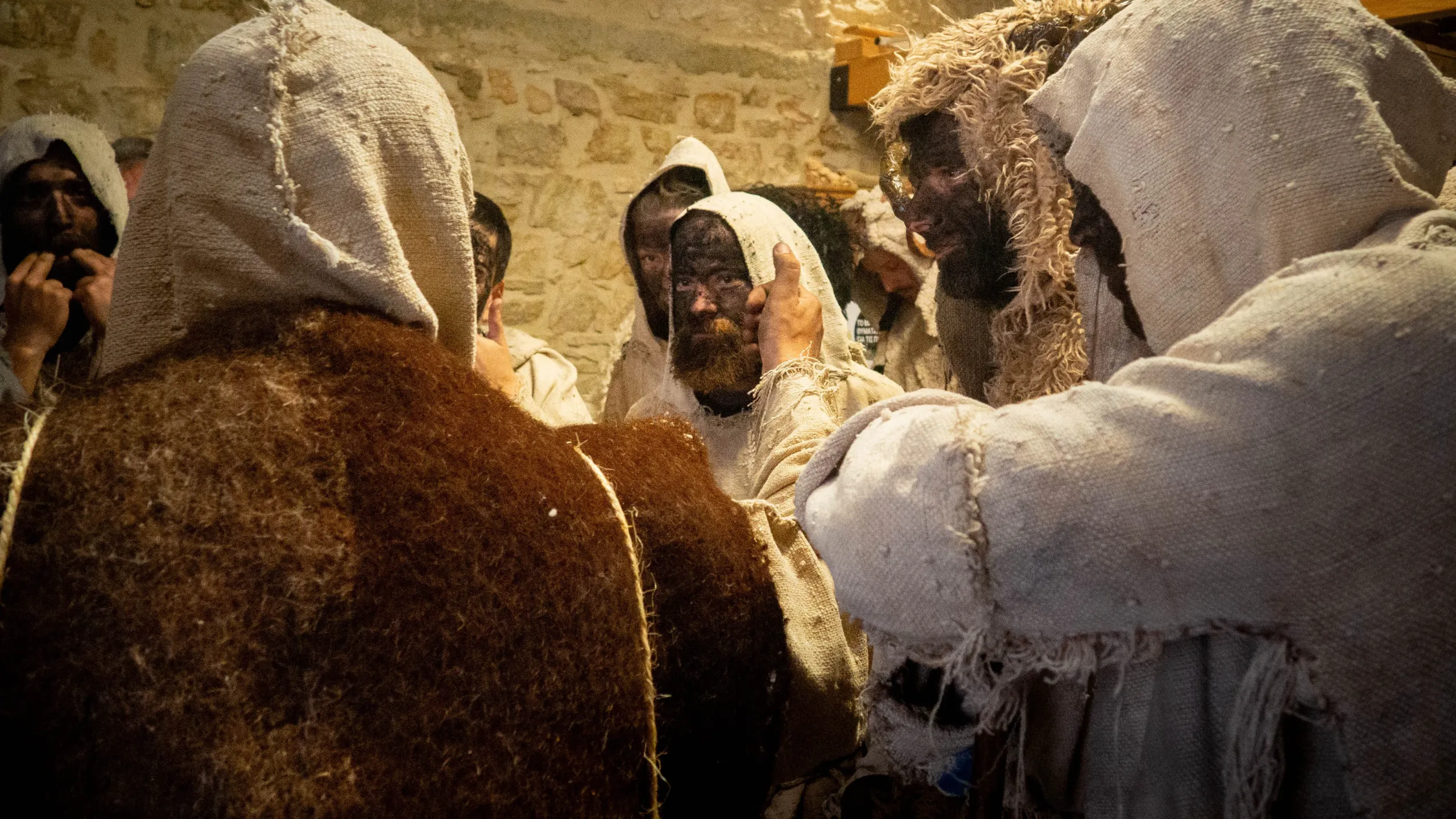 Participants in rustic costumes preparing for the Malliaros ritual Participants in rustic costumes preparing for the Malliaros ritual in Magganiako, Messinia, a traditional celebration of nature and folklore.
