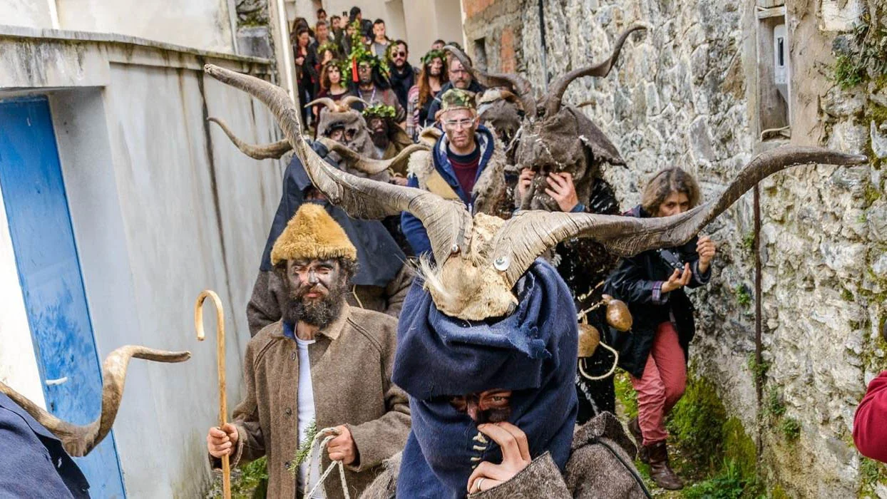 A procession of participants in fur costumes and horned headpieces during the Nedousa Carnival A procession of participants in fur costumes and horned headpieces during the Nedousa Carnival in Messinia, celebrating ancient Greek traditions.